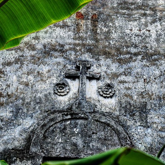 Relief of a cross on the walls of the ruined Vaipikkotta Portuguese Seminary, in Kottayil Kovilak…​